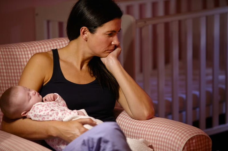 Parent with baby at night